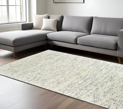 8' X 10' Ivory Hand Tufted Area Rug