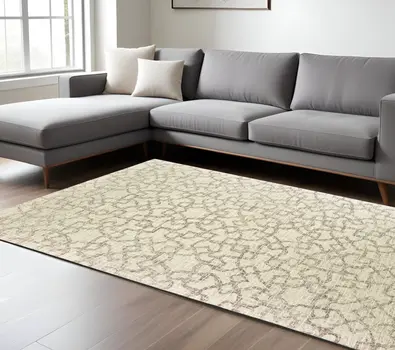 10' X 13' Tan And Ivory Wool Geometric Hand Tufted Area Rug