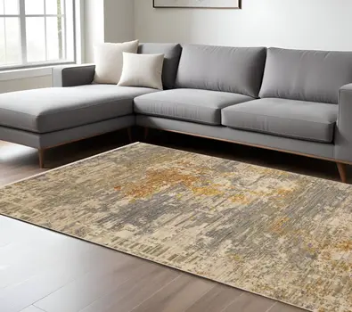 8' X 11' Beige And Gold Abstract Area Rug With Fringe