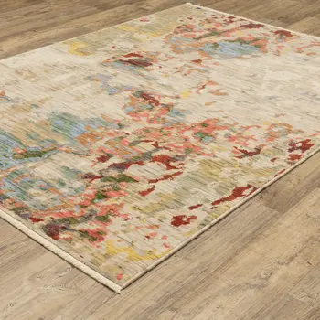 10' X 13' Beige Salmon And Tan Abstract Area Rug With Fringe