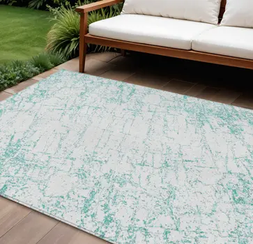 8' X 10' Teal Blue And Ivory Abstract Washable Indoor Outdoor Area Rug