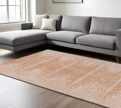 9' X 12' Salmon And Ivory Abstract Washable Indoor Outdoor Area Rug