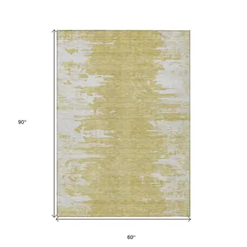 5' X 8' Gold And Ivory Abstract Washable Indoor Outdoor Area Rug