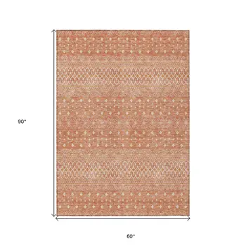 5' X 8' Salmon Gold And Ivory Tribal Washable Indoor Outdoor Area Rug