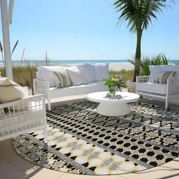 8' Charcoal Gray And Gold Round Quatrefoil Washable Indoor Outdoor Area Rug