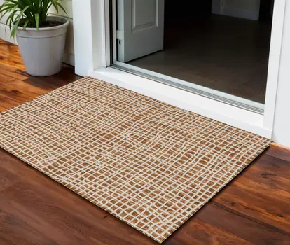 3' X 5' Orange Beige And Copper Striped Washable Indoor Outdoor Area Rug