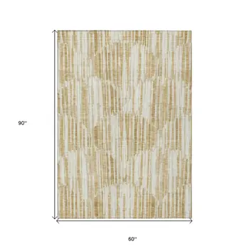 5' X 8' Gold Beige And Ivory Abstract Washable Indoor Outdoor Area Rug