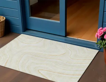 3' X 5' Ivory Beige And Tan Abstract Washable Indoor Outdoor Area Rug