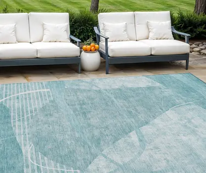 10' X 14' Turquoise Teal Blue And Ivory Abstract Washable Indoor Outdoor Area Rug