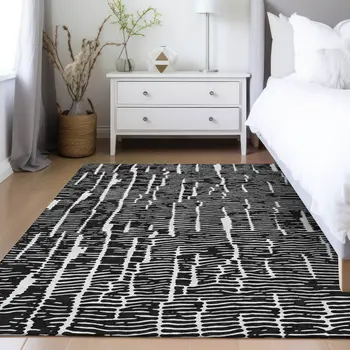 5' X 8' Black And Ivory Abstract Washable Indoor Outdoor Area Rug