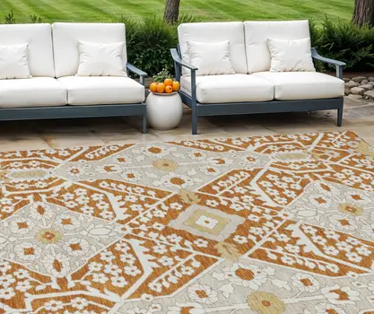 10' X 14' Orange Beige And Gold Floral Washable Indoor Outdoor Area Rug
