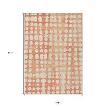 9' X 12' Coral And Ivory Abstract Washable Indoor Outdoor Area Rug