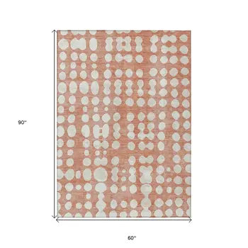5' X 8' Salmon And Ivory Abstract Washable Indoor Outdoor Area Rug
