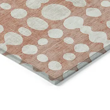 5' X 8' Salmon And Ivory Abstract Washable Indoor Outdoor Area Rug