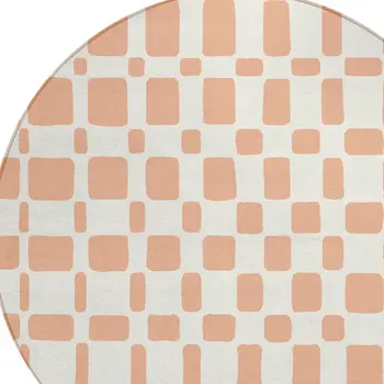 8' Peach And Beige Round Geometric Washable Indoor Outdoor Area Rug