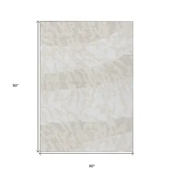 5' X 8' Ivory And Beige Animal Print Washable Indoor Outdoor Area Rug