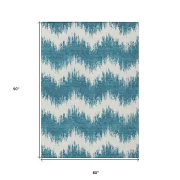 5' X 8' Teal Blue And Ivory Chevron Washable Indoor Outdoor Area Rug