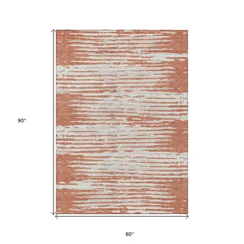 5' X 8' Coral And Ivory Striped Washable Indoor Outdoor Area Rug