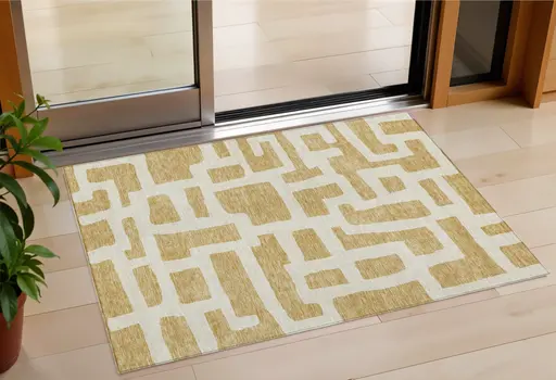 3' X 5' Gold And Ivory Abstract Washable Indoor Outdoor Area Rug