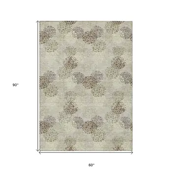 5' X 8' Beige Green And Ivory Polka Dot Washable Indoor Outdoor Area Rug