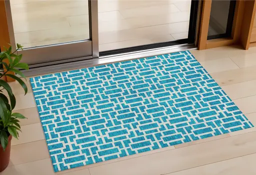 3' X 5' Turquoise And Ivory Geometric Washable Indoor Outdoor Area Rug