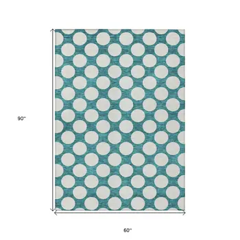 5' X 8' Teal Blue And Ivory Polka Dot Washable Indoor Outdoor Area Rug