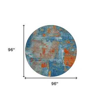 8' Navy Blue Orange And Ivory Round Abstract Washable Indoor Outdoor Area Rug