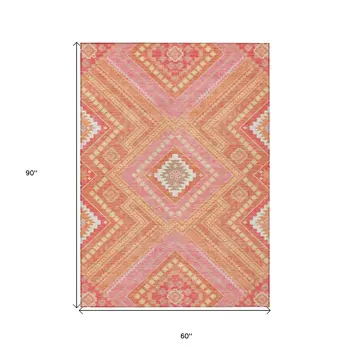 5' X 8' Coral Pink And Ivory Tribal Washable Indoor Outdoor Area Rug