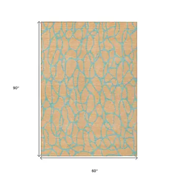 5' X 8' Mint Green And Peach Geometric Washable Indoor Outdoor Area Rug