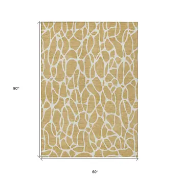 5' X 8' Gold And Ivory Geometric Washable Indoor Outdoor Area Rug