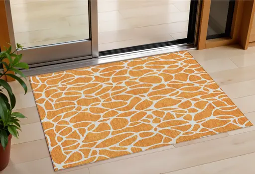 3' X 5' Orange And Ivory Geometric Washable Indoor Outdoor Area Rug