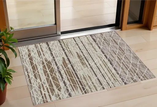 3' X 5' Beige Brown And Ivory Striped Washable Indoor Outdoor Area Rug