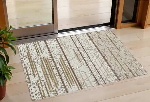 3' X 5' Ivory Brown And Beige Striped Washable Indoor Outdoor Area Rug