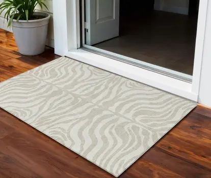 3' X 5' Beige And Tan Animal Print Washable Indoor Outdoor Area Rug