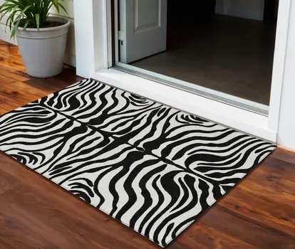 3' X 5' Black And Ivory Animal Print Washable Indoor Outdoor Area Rug