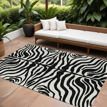 9' X 12' Black And Ivory Animal Print Washable Indoor Outdoor Area Rug