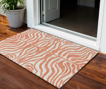 3' X 5' Coral And Ivory Animal Print Washable Indoor Outdoor Area Rug