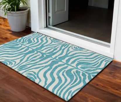 3' X 5' Teal Blue And Ivory Animal Print Washable Indoor Outdoor Area Rug