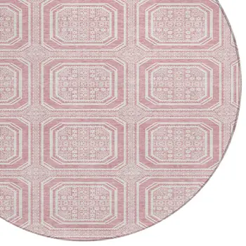 8' Pink And Ivory Round Geometric Washable Indoor Outdoor Area Rug