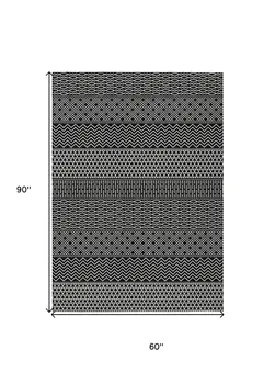 5' X 8' Black And Ivory Chevron Washable Indoor Outdoor Area Rug