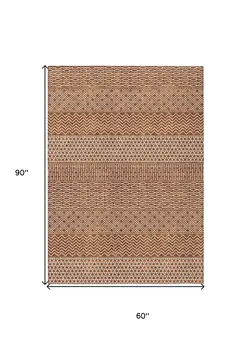 5' X 8' Orange And Ivory Chevron Washable Indoor Outdoor Area Rug