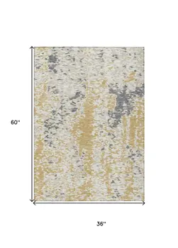 3' X 5' Gold And Ivory Abstract Washable Indoor Outdoor Area Rug