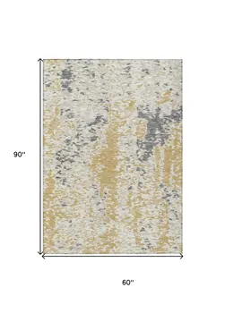 5' X 8' Gold And Ivory Abstract Washable Indoor Outdoor Area Rug