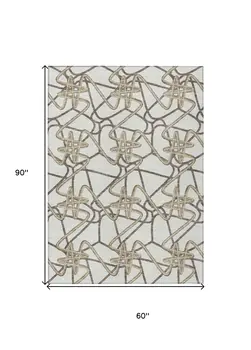 5' X 8' Ivory Charcoal And Gold Geometric Washable Indoor Outdoor Area Rug