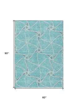 5' X 8' Teal Blue And Ivory Geometric Washable Indoor Outdoor Area Rug