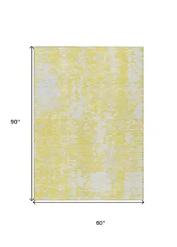 5' X 8' Yellow And Ivory Abstract Washable Indoor Outdoor Area Rug