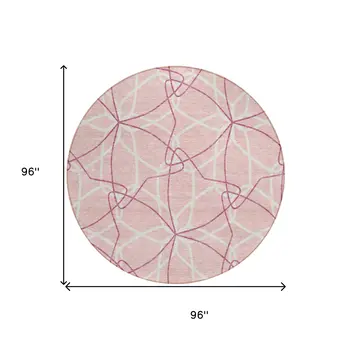 8' Pink And Ivory Round Geometric Washable Indoor Outdoor Area Rug