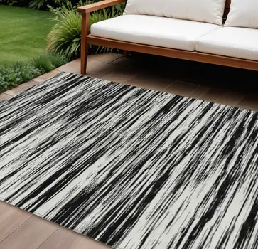 9' X 12' Black And Ivory Abstract Washable Indoor Outdoor Area Rug
