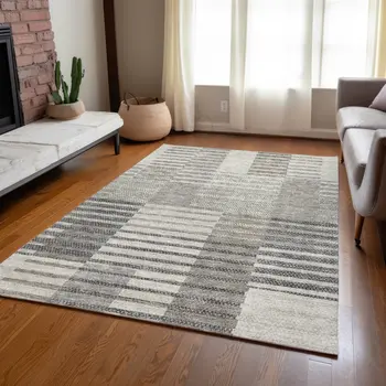 3' X 5' Beige Ivory And Taupe Striped Washable Indoor Outdoor Area Rug