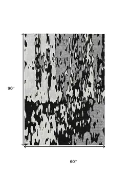 5' X 8' Black And Ivory Abstract Washable Indoor Outdoor Area Rug